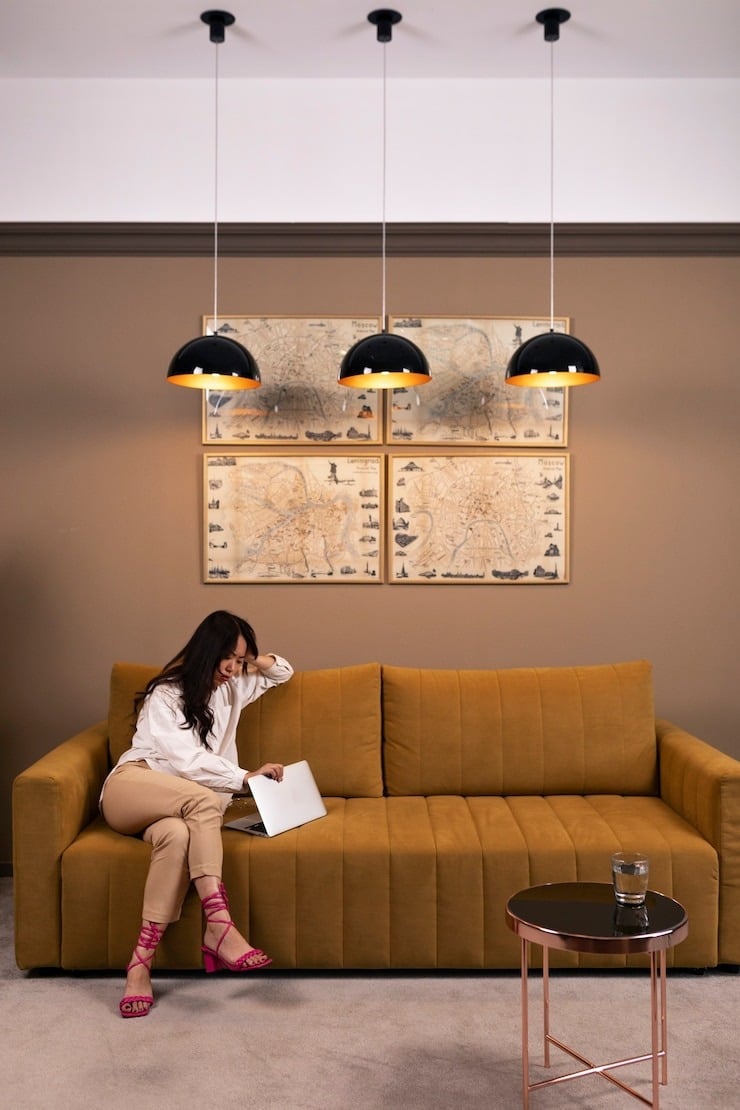 full shot woman sitting couch 23