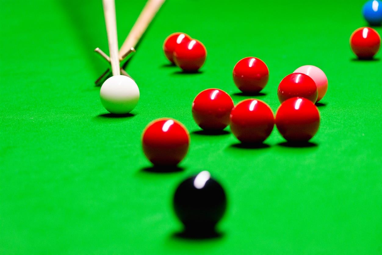 Stick on rest with snooker balls